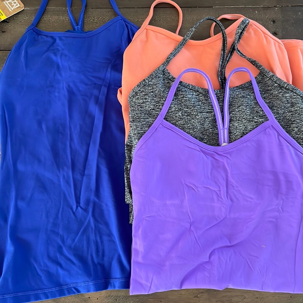 Four size 6 Lululemon yoga tops with built in bras